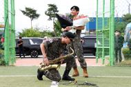 BTS's members RM (L) and V (R) react after being discharged from a mandatory military service on June 10, 2025 in Chuncheon, South Korea | Image via: Getty